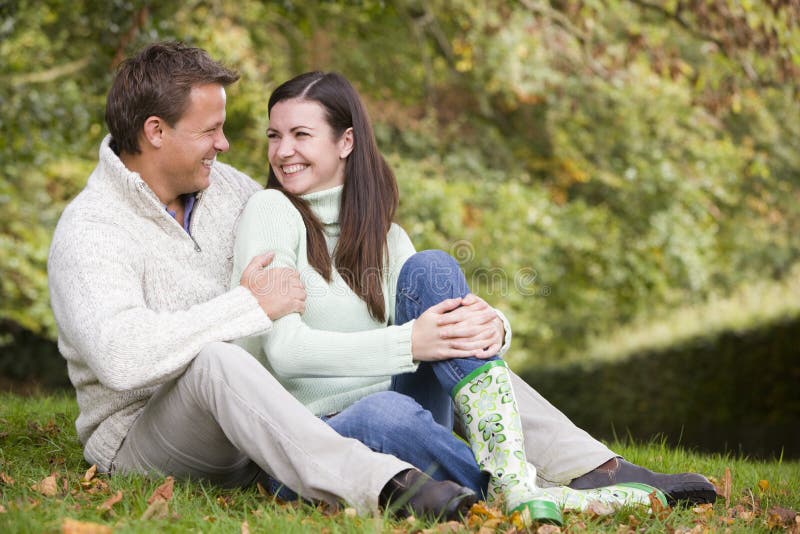Young couple relaxing in autumn woods