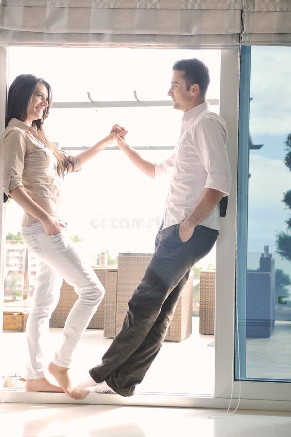 Couple relaxing on balcony