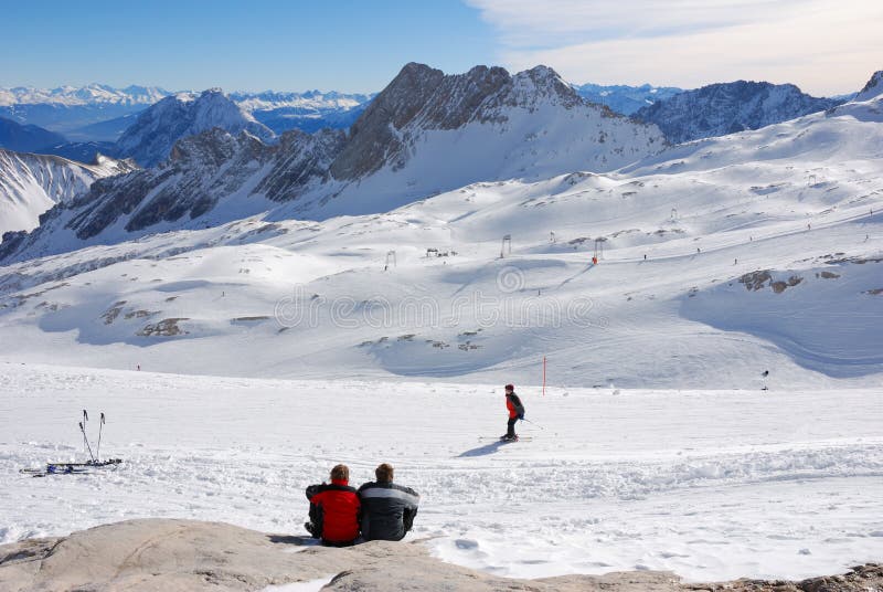 Couple resting in skiing area stock images