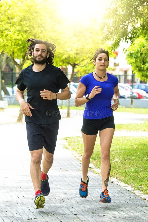 Couple running stock image. Image of park, beautiful 54057261