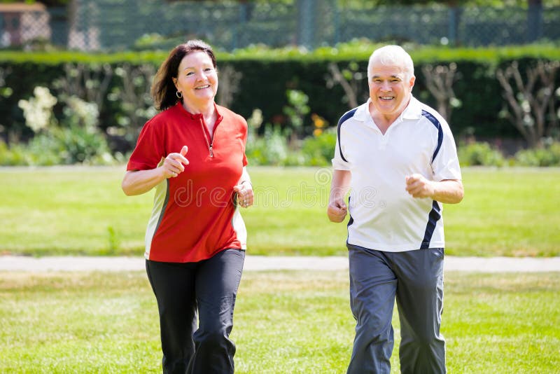 Couple Running In Park royalty free stock images Couple Running In Park royalty free stock images