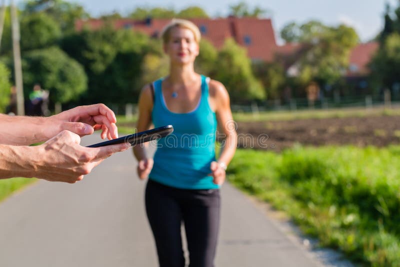 Couple running, sport jogging on rural street