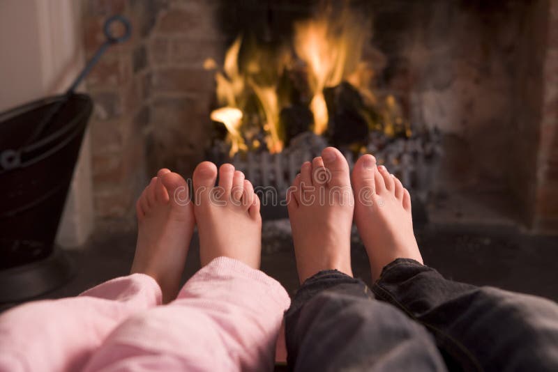 Feet Warming at Fireplace with Hands Holding Wine Stock Image Image