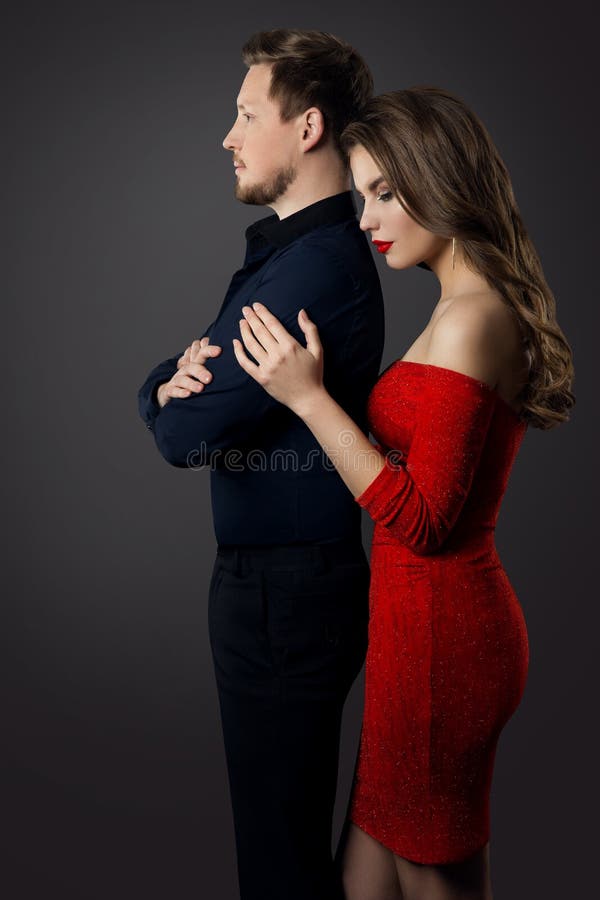 Couple, Sad Woman Embracing Serious Man, People Relationship studio Family Portrait. Couple, Sad Woman Embracing Serious Man, People Relationship studio Family Portrait