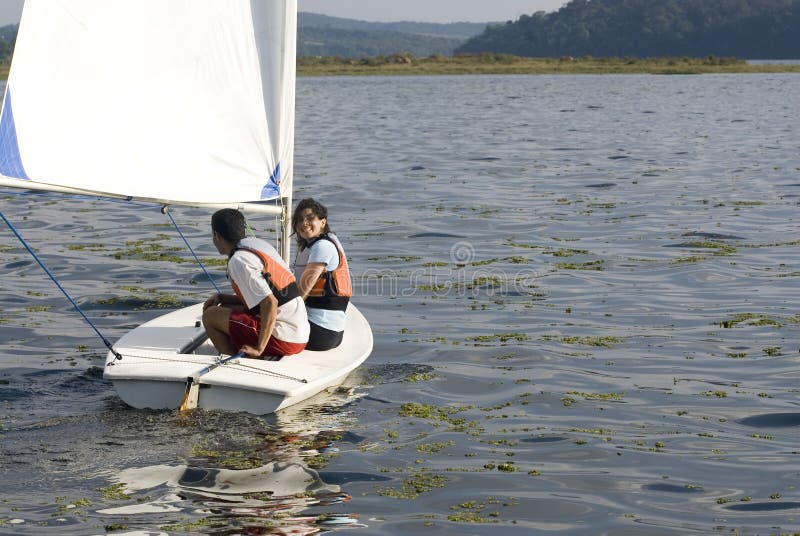 Couple Sailing Across Lake - Horizontal