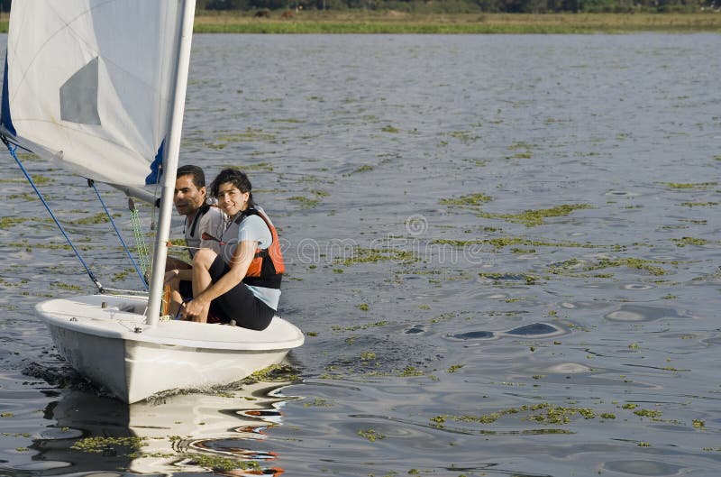 Couple Sailing Across Lake - Horizontal