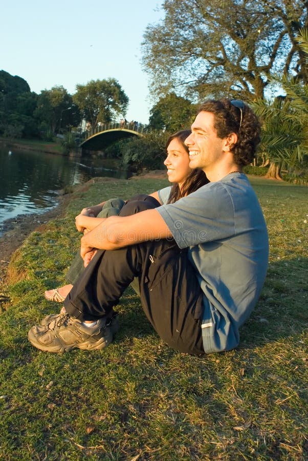 Couple Seated by the Pond - Vertical