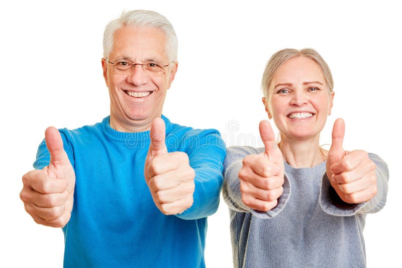 Couple of seniors holding their thumbs up royalty free stock photography Couple of seniors holding their thumbs up royalty free stock photography