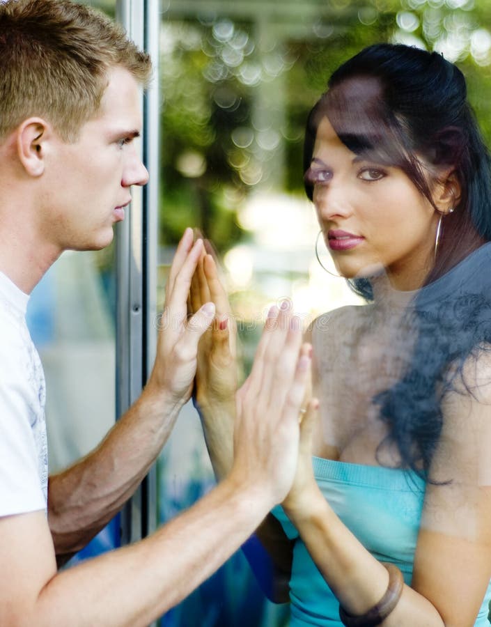 Couple separated by glass stock photo. Image of divide 8886196