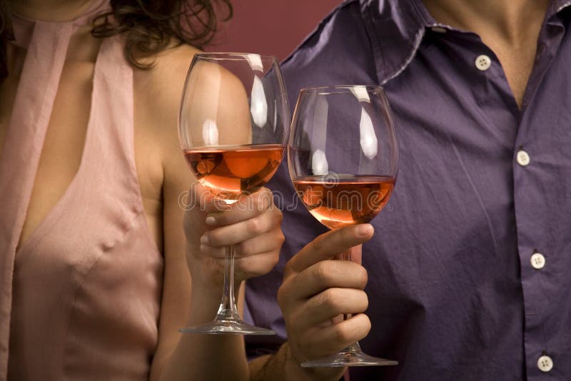 Couple sharing a glass of red wine