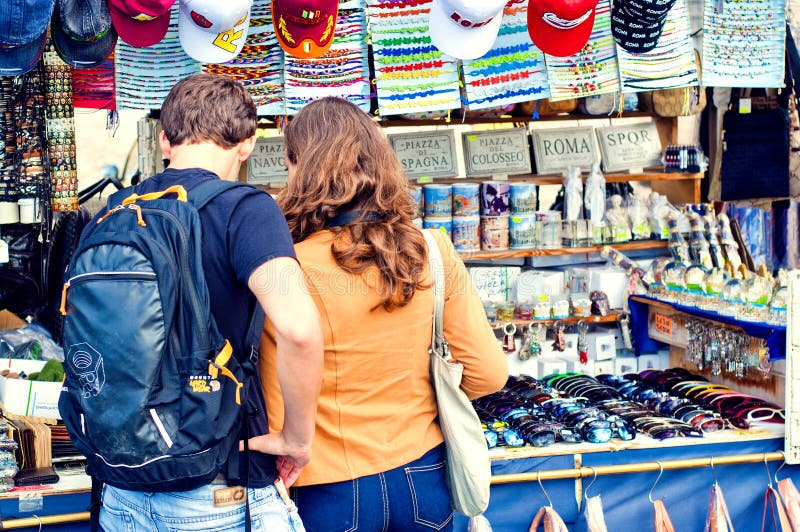 Couple shop for souvenirs whilst on holiday Rome stock image Couple shop for souvenirs whilst on holiday Rome stock image
