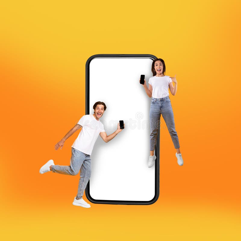 Couple showing white empty smartphone screen and jumping