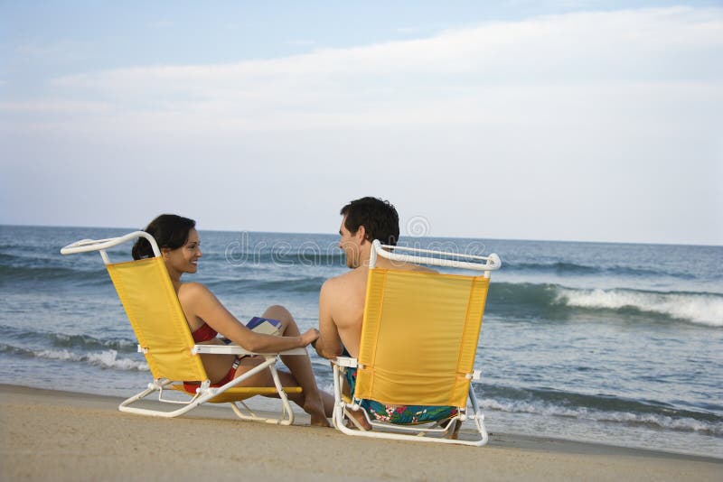 Couple Sitting on Beach royalty free stock images Couple Sitting on Beach royalty free stock images