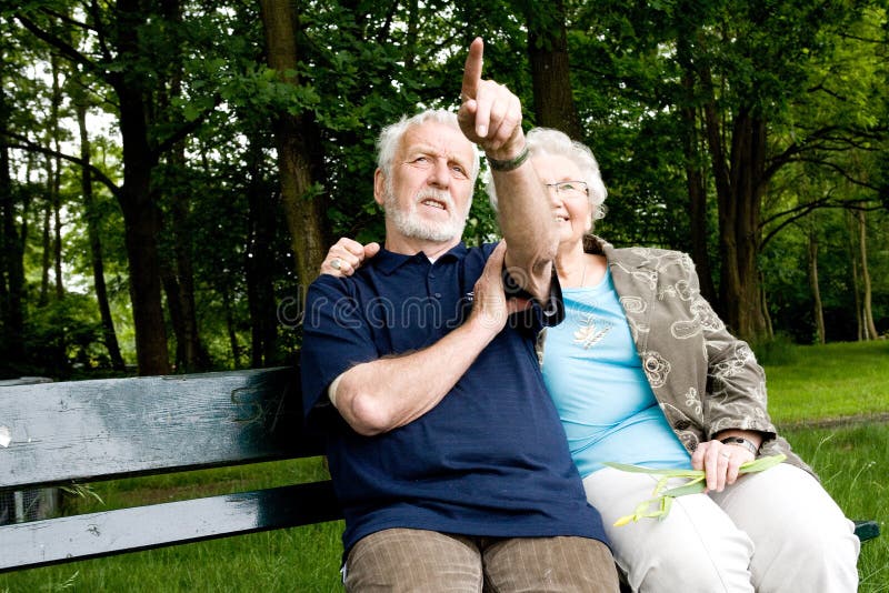 Couple sitting outside on a park bench