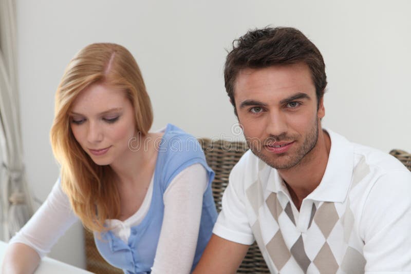 Couple sitting at a table stock photo. Image of looking 26505068