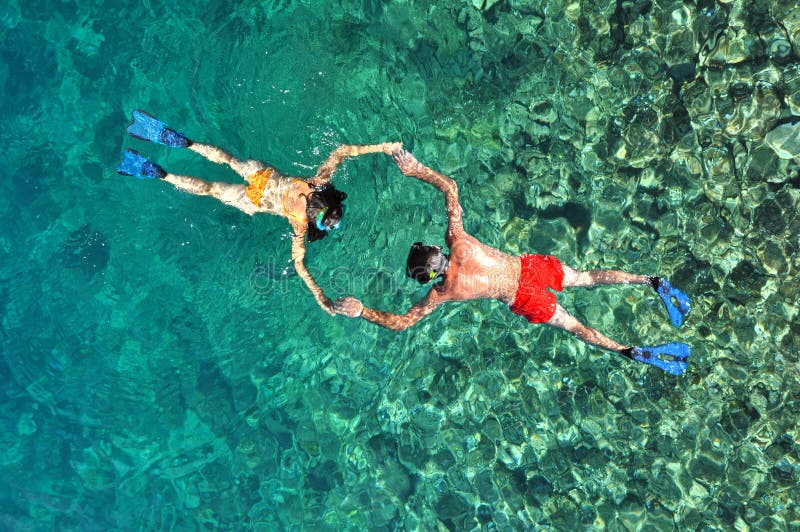 Couple snorkeling in Phi Phi island, Thailand