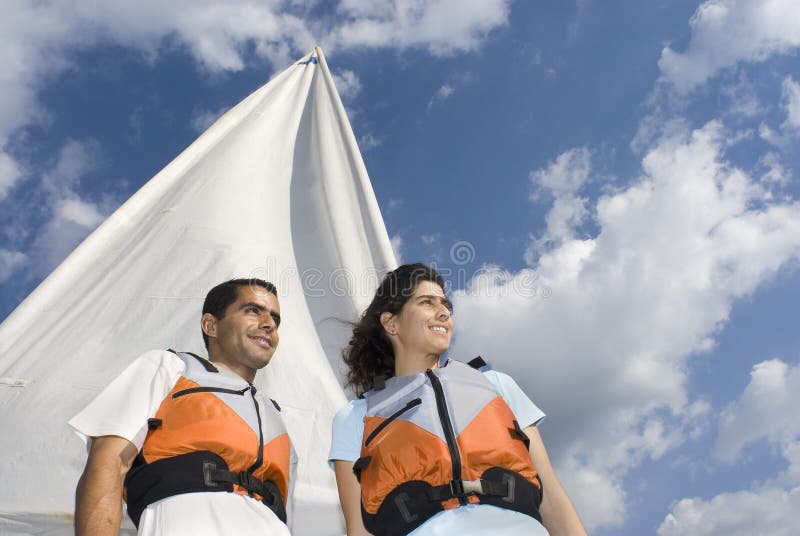 Couple Standing in Front of Sail - Horizontal
