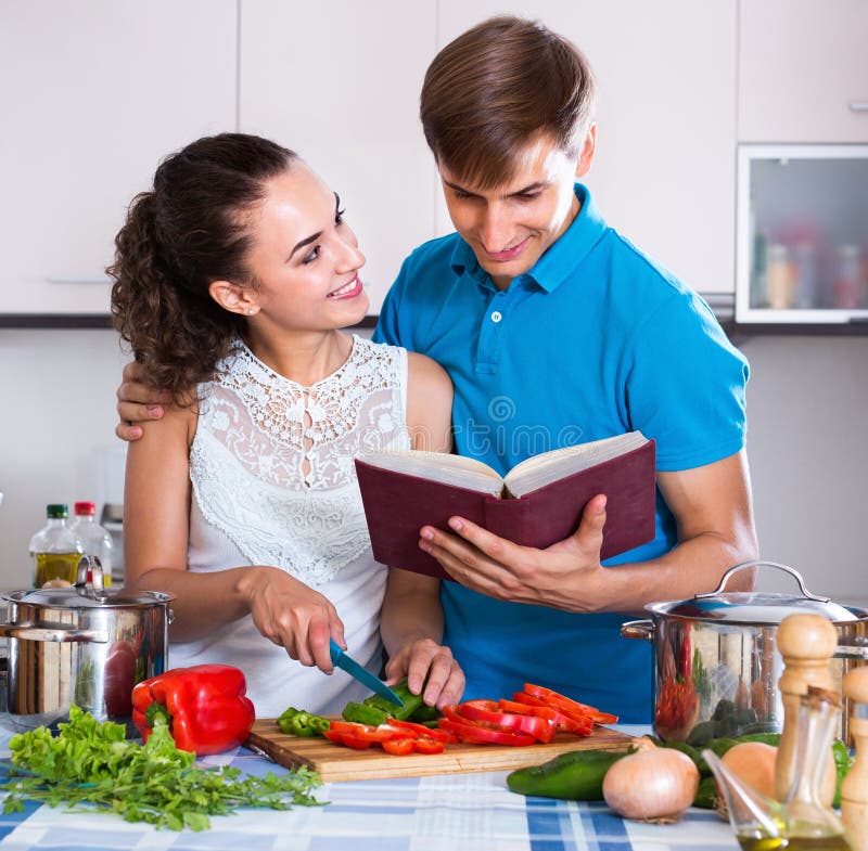 Couple Standing Near Table With Vegetables Stock Phot
