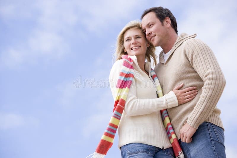 Couple standing outdoors smiling stock image Couple standing outdoors smiling stock image