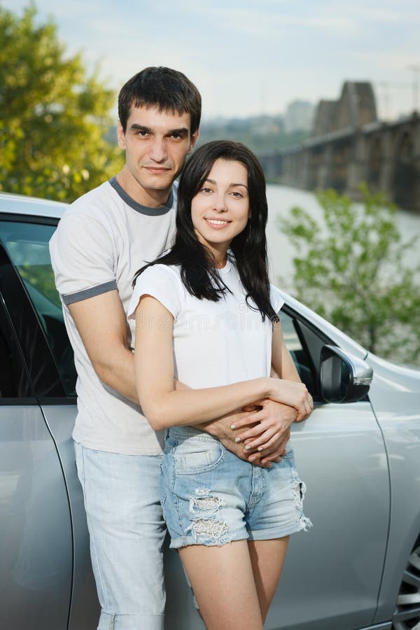 romantic moment couple looking on sunset near white suv car Stock Photo -  Alamy