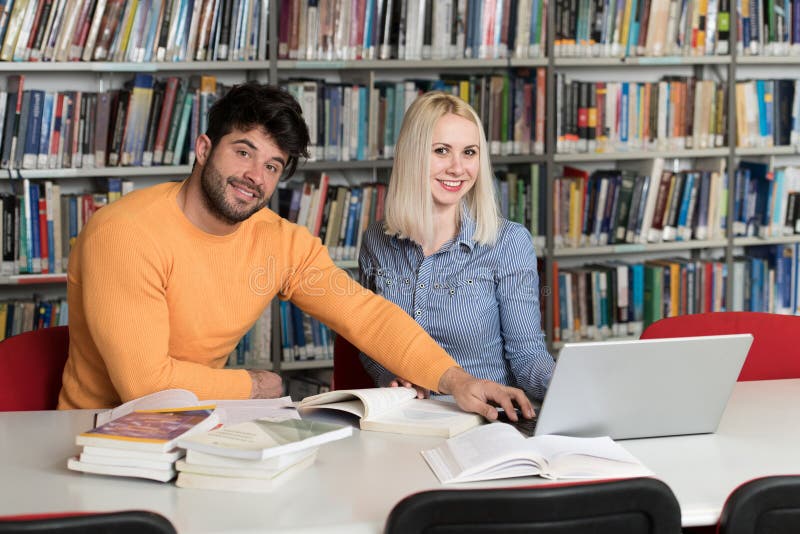 Couple Of Students With Laptop In Library Stock Photo Image Of Bl