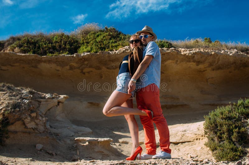 Couple in sunglasses embrace in the day in the hills royalty free stock photography Couple in sunglasses embrace in the day in the hills royalty free stock photography