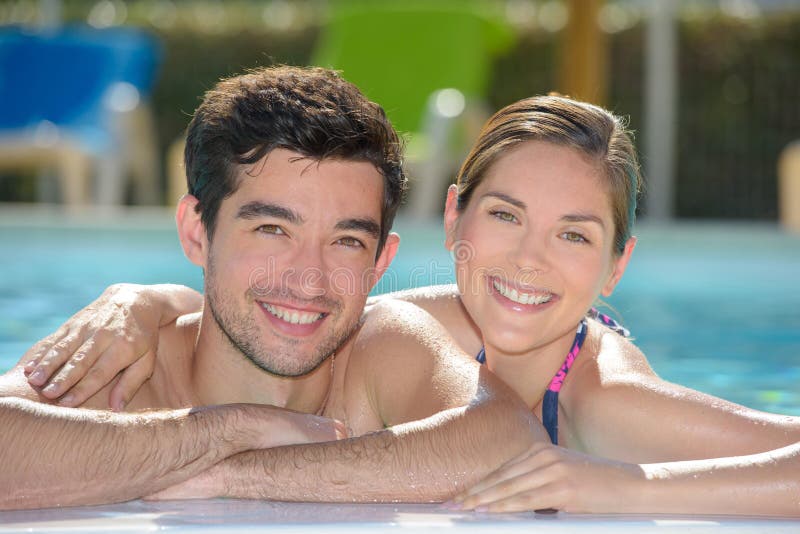 Couple in swimming pool stock image. Image of love, boyfriend 117901987