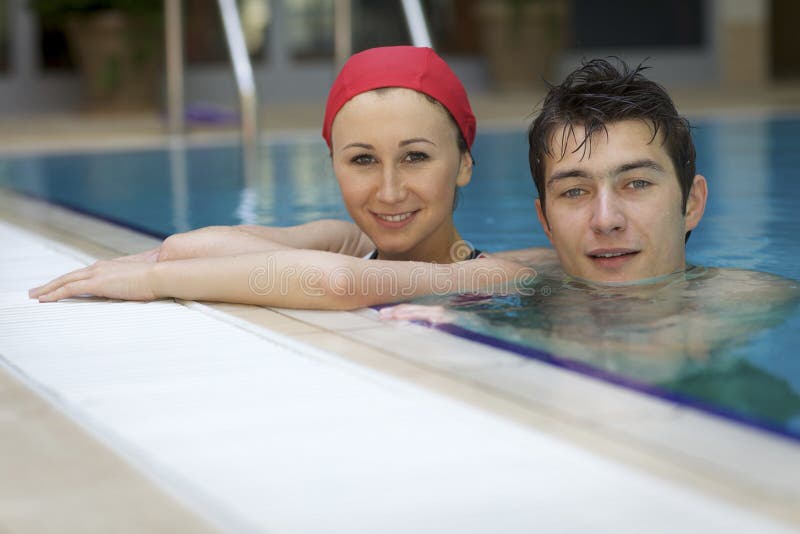 Couple in swimming pool stock image. Image of relax, people 53755427