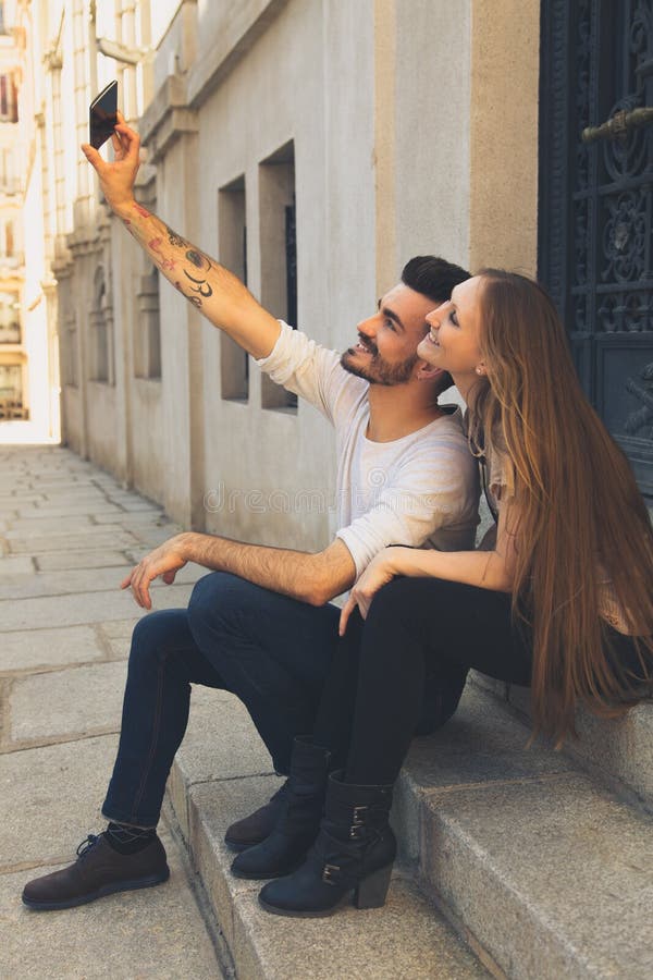 Couple Taking Self Portrait With Iphone Beautiful Young Couple Stock