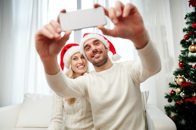 Couple Taking Selfie with Smartphone at Christmas Stock Image - Image ...