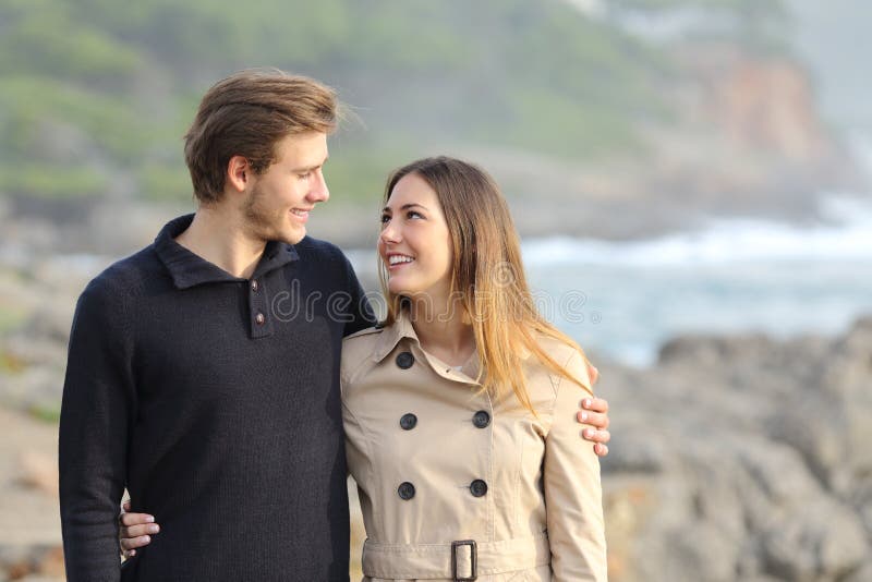 Couple taking a walk on the beach