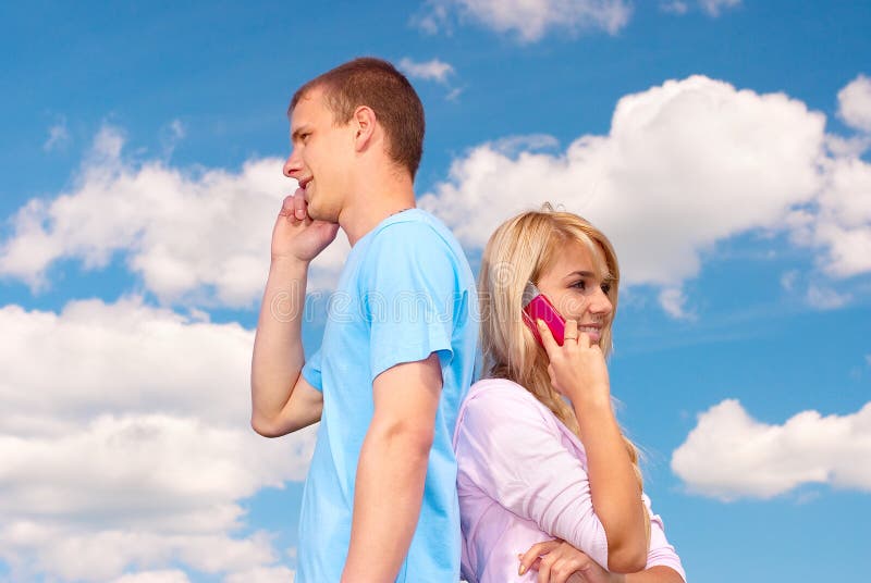 Couple talk on cell phones stock photography Couple talk on cell phones stock photography