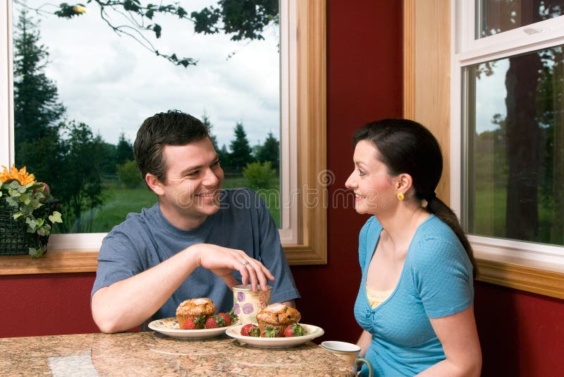 A Couple Talking At Breakfast at - Horizontal