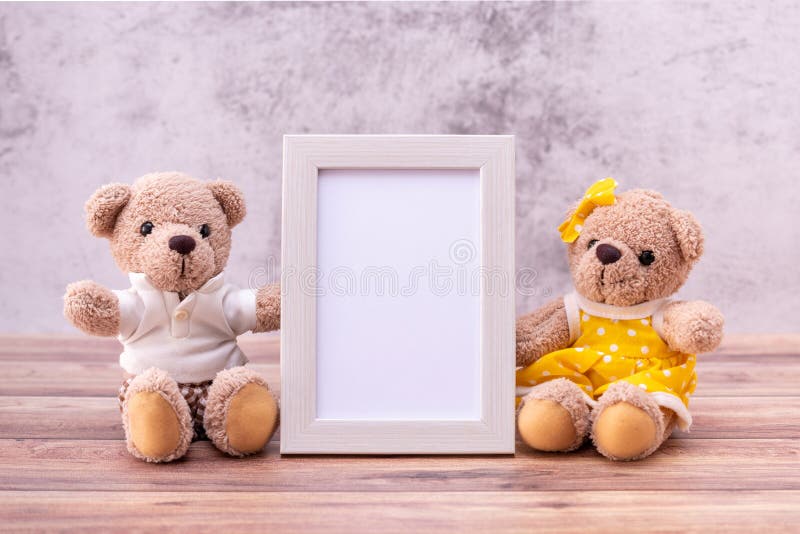 Couple teddy bear with Picture frame on table wooden. Valentine`s Day celebration