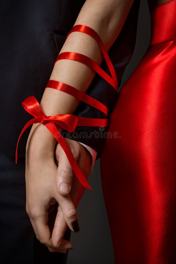 Couple Tied Hands, Woman and Man Arms Bonded Together by Red Ribbon, Relationship
