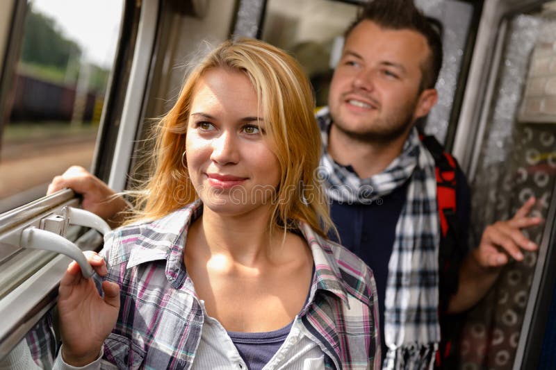 Couple in train looking out the window royalty free stock photo