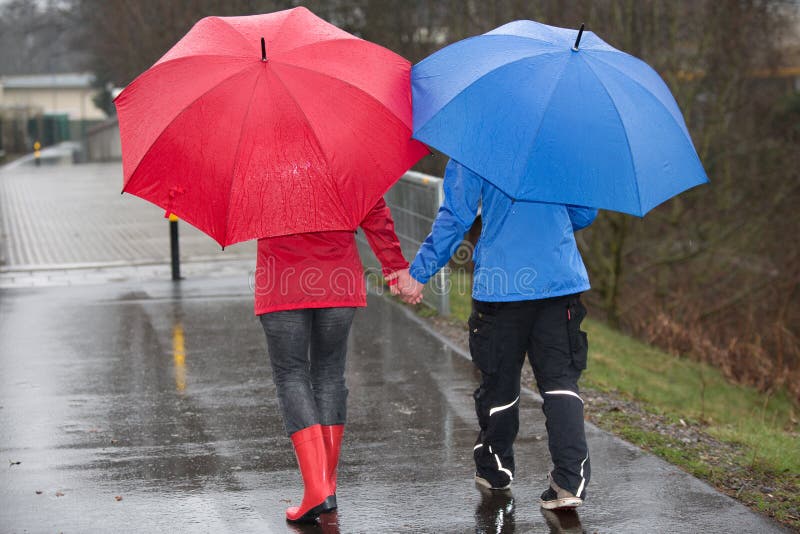 Couple Hand Hand Walking Rain Photos Free Royalty Free Stock Photos From Dreamstime