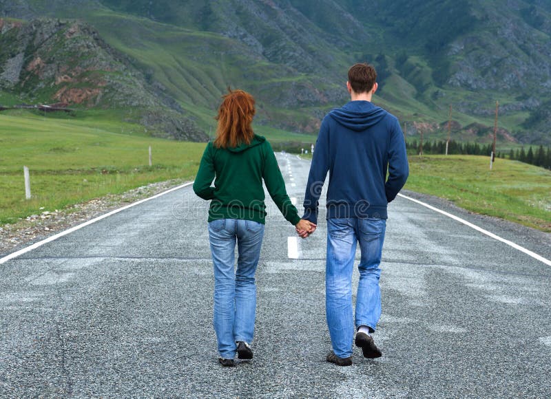 Couple walking Altai road