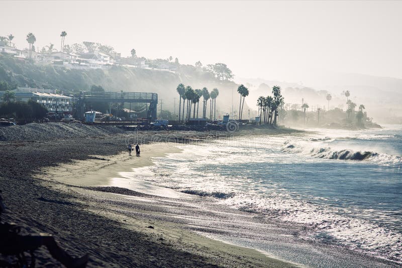 Couple Walking on a California Beach in a Misty Morning Stock Image ...