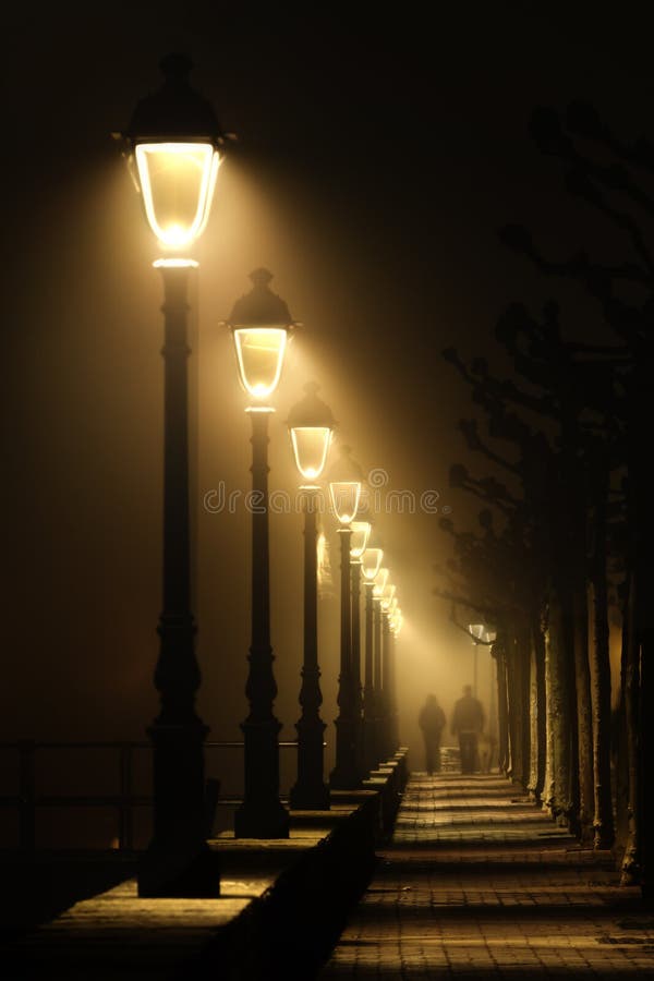 Old Fashioned Street Lamp At Night. Magic Lamp With A Warm Yellow Light In  The City Twilight Stock Photo - Image Of City, Lamp: 158800990