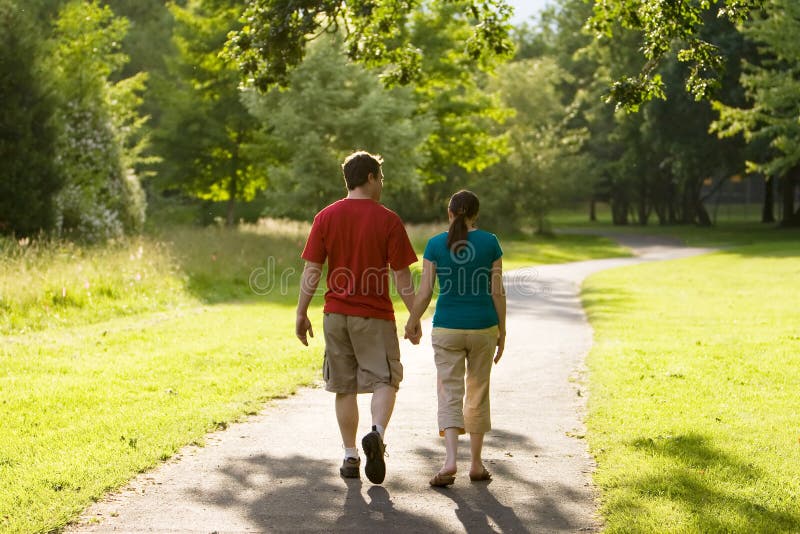 Couple Walking Through Park-Horizontal