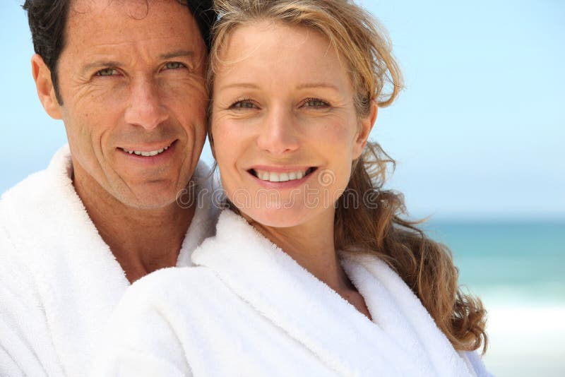 Couple Wearing Dressing Gowns Stock Photo Image of recreation, beach
