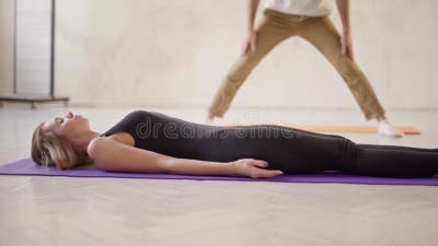 Side View Sporty Relaxed Woman Practicing Yoga in Yoga Class, Lying in  Resting Pose Savasana or Dead Body Exercise in Stock Video - Video of  class, sport: 173017877