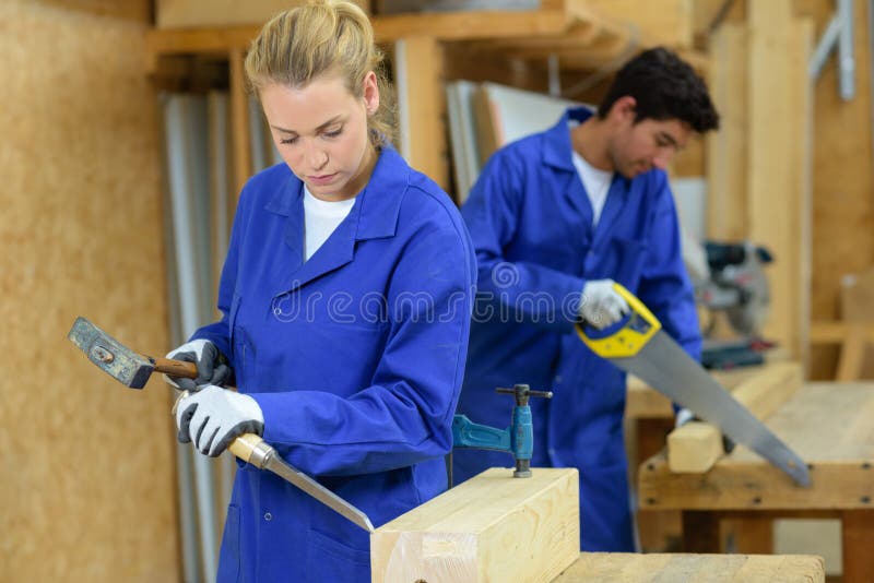 Couple workers woodworking royalty free stock photography Couple workers woodworking royalty free stock photography