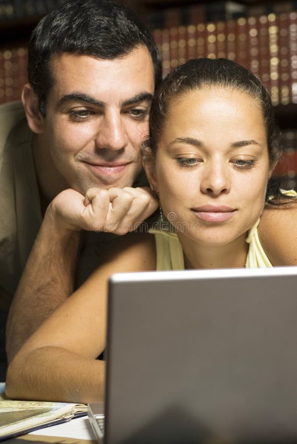 Couple Working on Laptop - Vertical