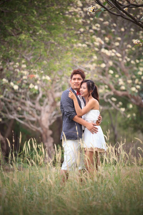 Couples of asian people in wedding suit