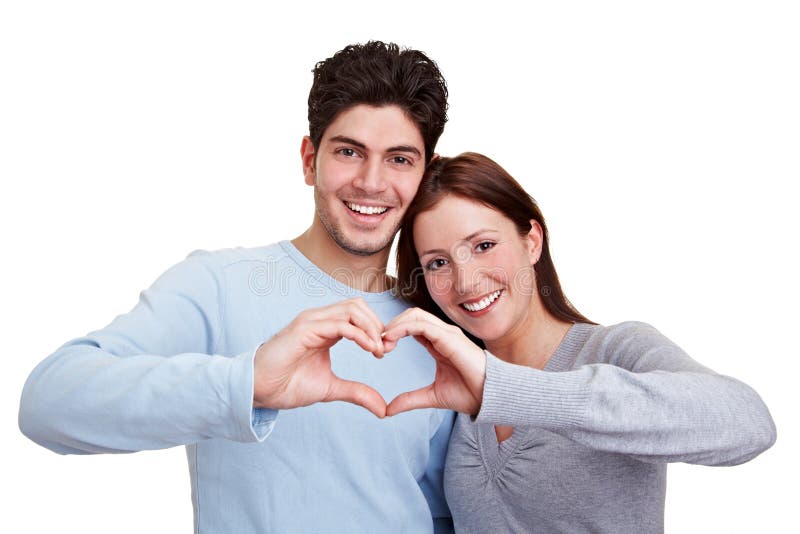 Happy couple in love showing heart with their fingers. Happy couple in love showing heart with their fingers