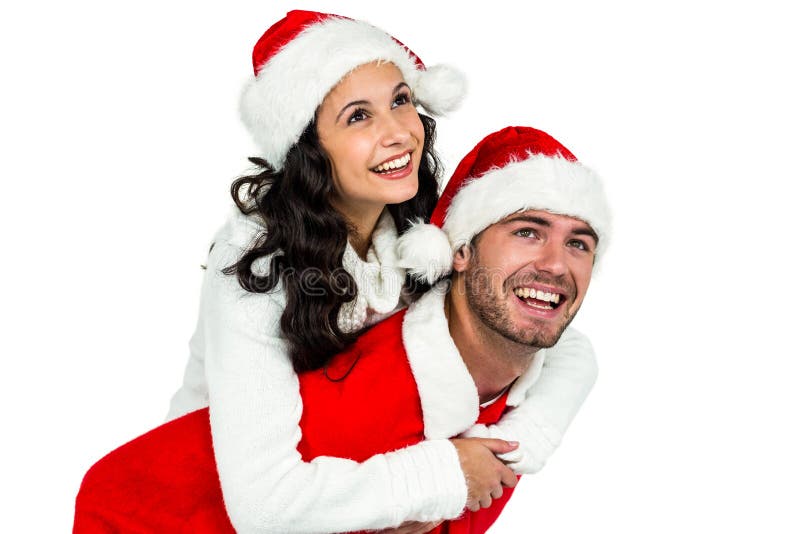 Festive couple smiling at camera on white background. Festive couple smiling at camera on white background