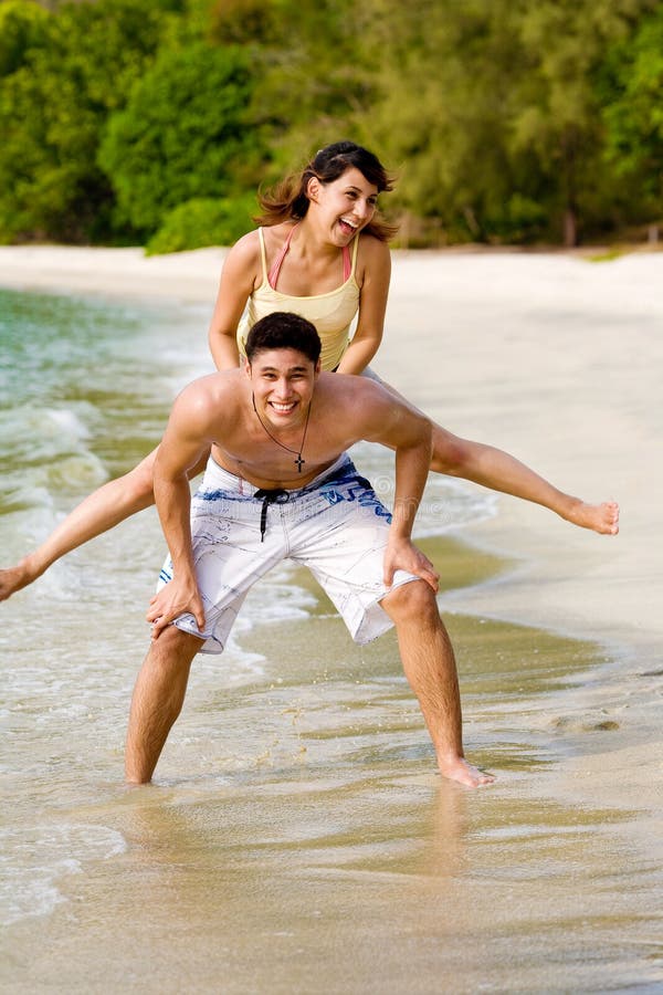 Couples having fun by the beach