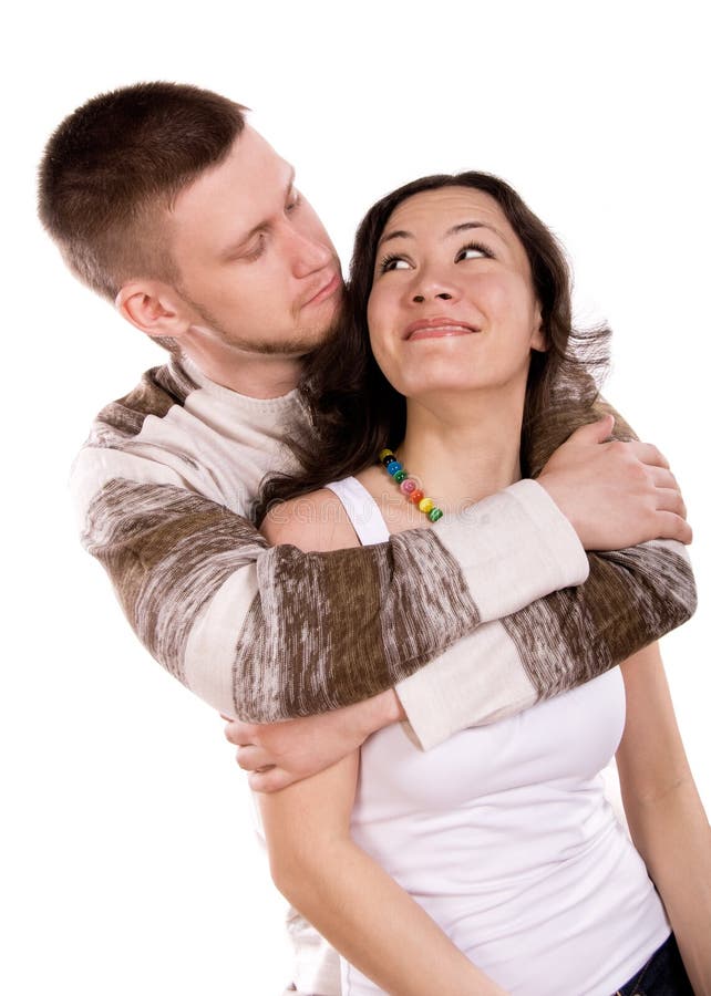 Happy loving young couple against white background. Happy loving young couple against white background